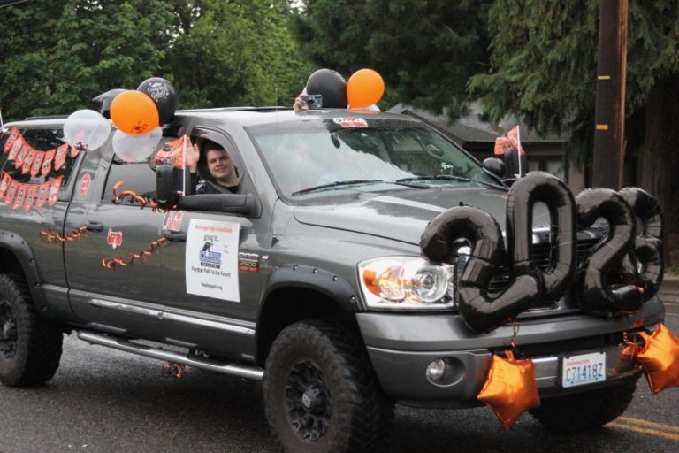 Washougal High School seniors drive in a community celebration of Washougal's class of 2023 in downtown Washougal on Friday, June 9, 2023.