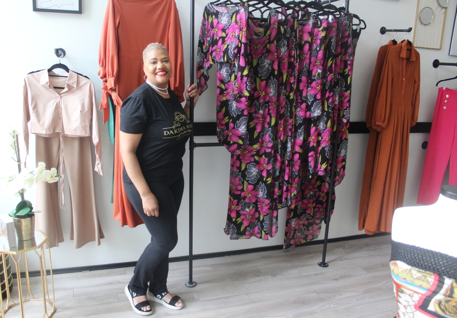 Washougal shop owner Dakima Hicks stands inside her Dakima Maria Boutique in downtown Washougal, in May 2023. (Eugene Putin/PutinMedia)