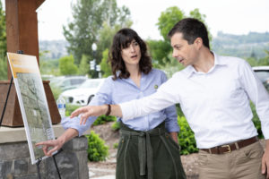 U.S. Secretary of Transportation Pete Buttigieg (right) talks with Rep. Marie Glusenkamp-Perez about the city of Washougal's 32nd street underpass project on Friday, July 7, in Washougal. (Contributed photo courtesy of the city of Washougal)