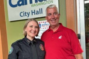 Camas's new police chief, Tina Jones (left), stands outside Camas City Hall with retiring Camas Police Chief Mitch Lackey on Monday, July 3, 2023. (Contributed photo courtesy of Mitch Lackey)