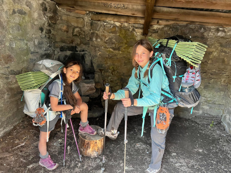Washougal residents Lilliana Lavasseur, 8, (left) and Katya Firstenburg, 11, take a break while hiking the challenging 42-mile Timberline Trail on Oregon's Mount Hood in July 2023.