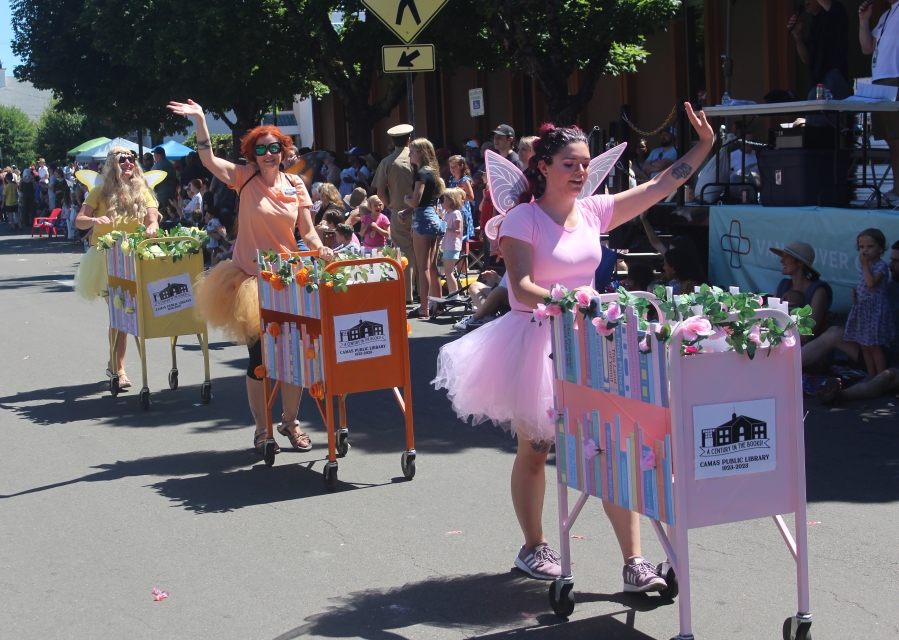 A member of the Downtown Camas Association Light Brigade team celebrates after winning the 2023 Camas Days bathtub races Saturday, July 22, 2023, in downtown Camas.