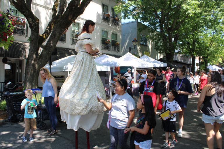 Top: Spider-Man protects the 2023 Camas Days crowds in downtown Camas Friday, July 21, 2023.
Above: A stilt-walker passes out information about the city of Camas' free 2023 Movies in the Park events on Friday, July 21, 2023, during the 2023 Camas Days celebration held  the third weekend in July throughout downtown Camas. (Kelly Moyer/Post-Record)