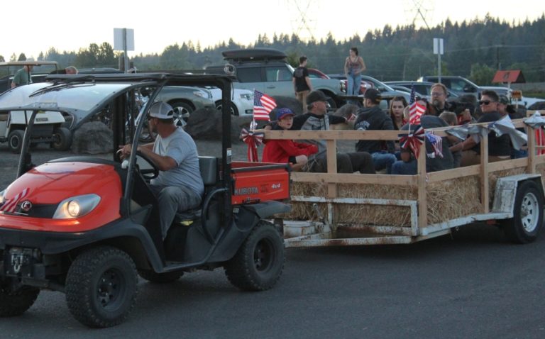 Doug Flanagan/Post-Record 
 Attendees participate in a hayride during the Port of Camas-Washougal's Fourth of July Celebration event in July 2022.