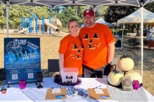 Wasougal residents Ann (left) and Grant Gilson pose for a photo during the city of Washougal's Harvest Festival event in October 2022. The Gilsons attended the event to promote their efforts to bring a teen center to Washougal. (Contributed photo courtesy of Grant Gilson)