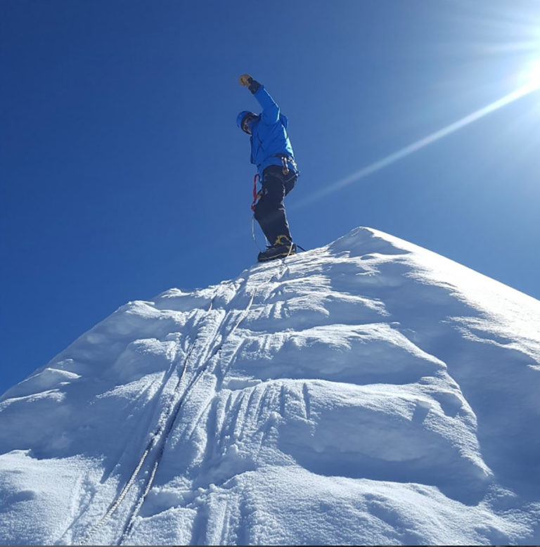 Camas resident Doug Kabel celebrates reaching the top of a Himalayan mountain peak in southeast Asia in 2022.