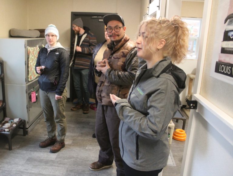 West Columbia Gorge Humane Society shelter assistant Mary Jadid (right) leads a tour of the animal shelter's new cat facility earlier this year.
