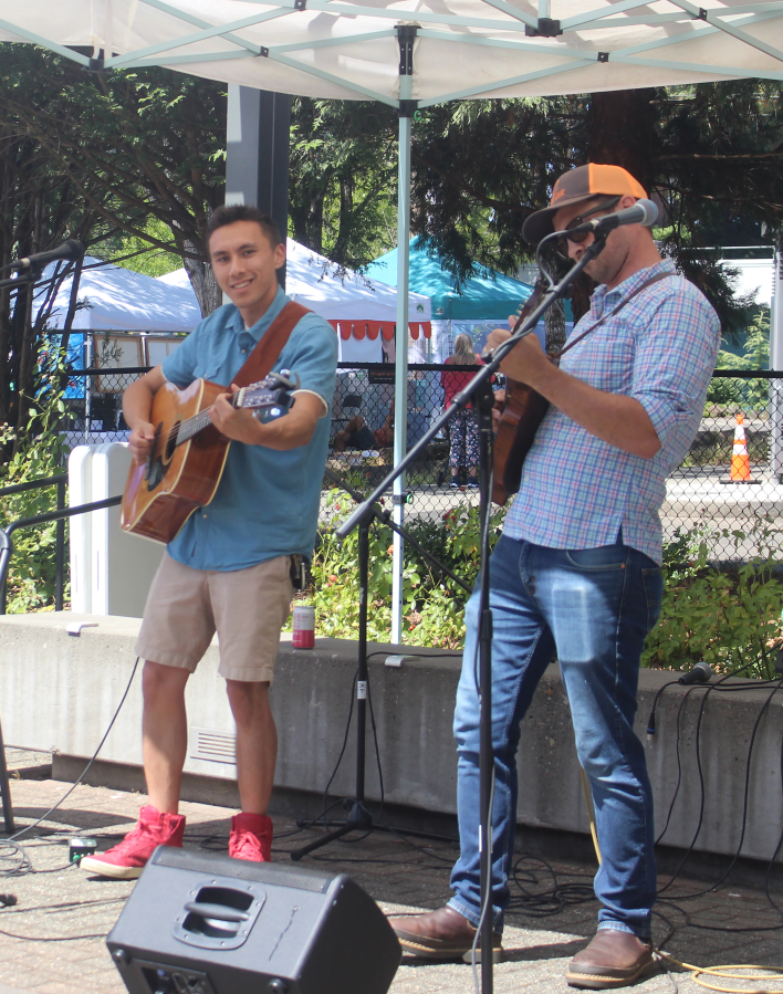 Lukas Johnson (left) and Evan Hathaway perform during the first annual Washougal Songcraft Festival on Saturday, Aug. 12, 2023, at Reflection Plaza in downtown Washougal. (Photos by Doug Flanagan/Post-Record)