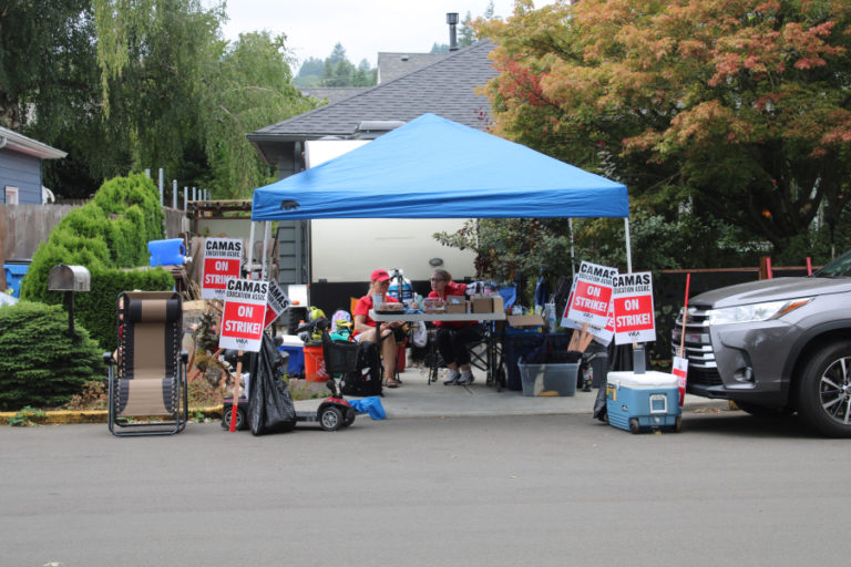 A tent with refreshments greets Camas teachers striking near Helen Baller Elementary, Liberty Middle and Hayes Freedom High schools Monday, Aug. 28, 2023.