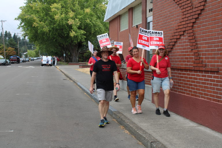 Camas teachers walk the picket line near Liberty Middle School in Camas, Monday, Aug. 28, 2023. The teachers are striking over classroom sizes, cost-of-living salary increases and equitable funding for music, health, physical education and library programs.