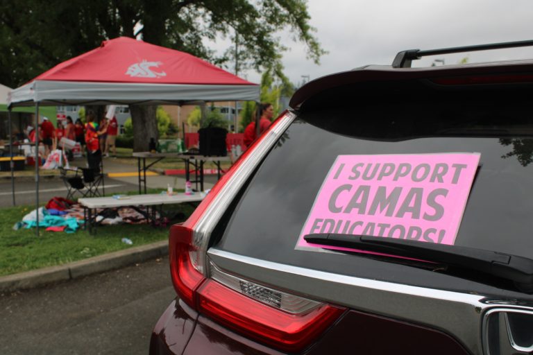 A sign in the back of a vehicle parked near Helen Baller Elementary School in Camas shows support for Camas teachers on strike for better wages, classroom sizes and more Monday, Aug. 28, 2023.