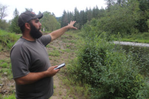 Washougal resident Mike Duzan on Monday, Sept. 4, 2023, gestures to a portion of a 150-acre property near his home that is slated for development as an adventure park. (Doug Flanagan/Post-Record)