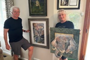 Gary and Deborah Watson show some of their elephant-themed artwork, including a painting by Gary and a 3-D art quilt by Deborah, at their east Clark County home Aug. 17, 2023. (Kelly Moyer/Post-Record)