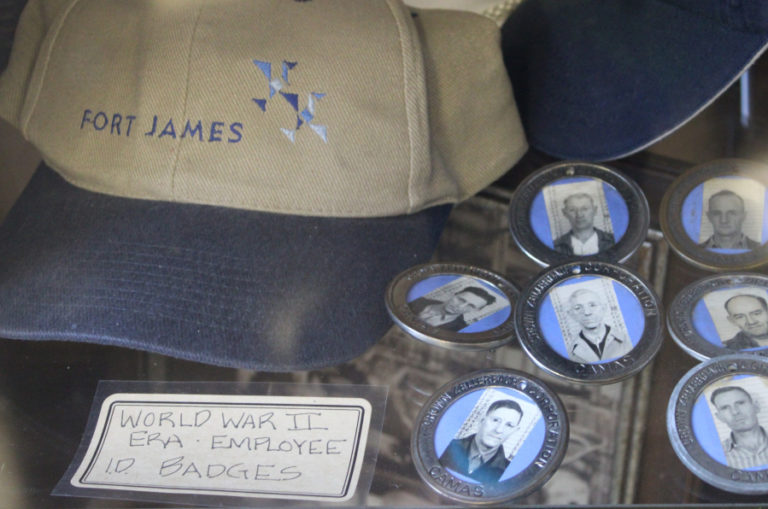 Employee badges from the World War II era sit next to a James River hat inside the Camas paper mill's interpretive center Friday, Sept. 1, 2023. The mill celebrated its 140th year in business during the Downtown Camas Association's September First Friday event.