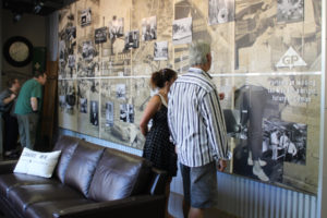 Visitors to the Georgia-Pacific paper mill's interpretive center read about the Camas mill's historical highlights Friday, Sept. 1, 2023. The paper mill, located in downtown Camas, is celebrating its 140th year in business in 2023. (Kelly Moyer/Post-Record)