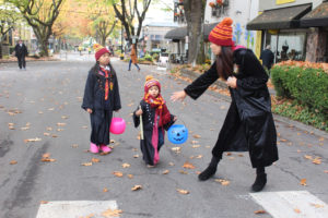 A Hogwarts family makes their way down Northeast Fourth Avenue in Camas during the 2018 Boo Bash, on Wednesday, Oct. 24, 2018. Pictured: Mom Kelly (right) with her two children, Julamani, 6 (left), and Jameson, 3 (center). (Kelly Moyer/Post-Record files) 