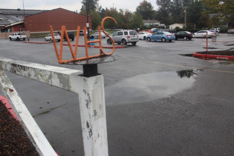 A large puddle welcomes visitors into the Washougal High School student parking lot on Monday, Oct. 9.