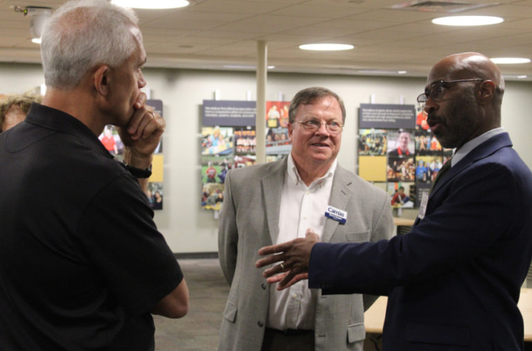 Camas Mayor Steve Hogan (center) and Camas City Councilman Tim Hein (left) talk to one of two city administrator candidates, Bristol Ellington during an open house at the Camas School District headquarters, Tuesday, Sept. 13, 2022.