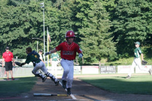 Dante Humble scores the first run for the Camas 11- to 12-year-old all-star team in the district championship game at Forest Home Park in Camas in July 2014. (Post-Record files)