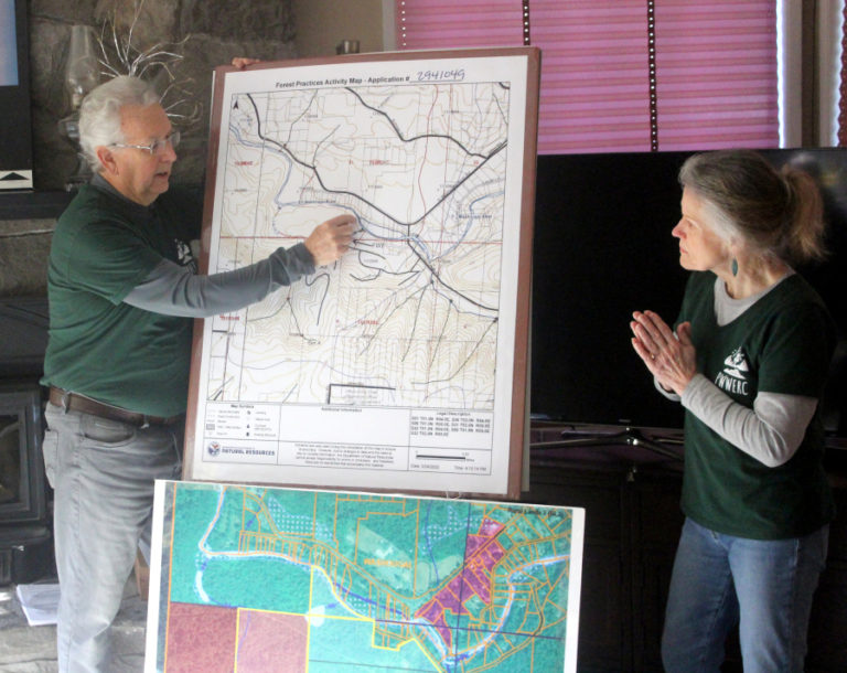 Keith Brown (left), the treasurer for the Preserving Washougal and West End Rural Character organization, and Teresa Robbins, a PWWERC volunteer, deliver a presentation about a proposed project to bring an adventure park to rural Washougal on Saturday, Oct. 28, 2023.