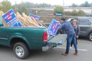 Camas resident Roman Battan (left) gives 