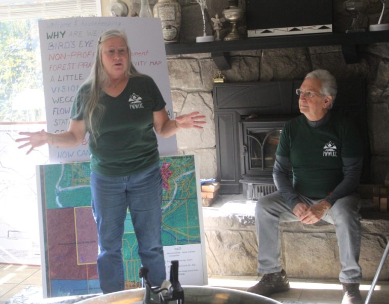 Preserving Washougal and West End Rural Character President Mary Grode (left) speaks about a proposed project to bring an adventure park to Skamania County while the group's treasurer, Keith Brown, listens at a residence in rural Washougal, on Saturday, Oct.