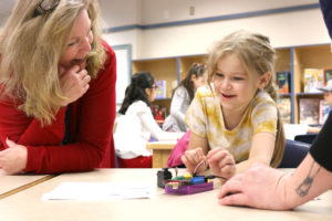 Gause Elementary School principal Tami Culp helps a student with her robot prototype during a robotics lesson in December 2022. Culp has assumed leadership duties for the Washougal Learning Academy after the Washougal School District eliminated the online school's principal position due to lower-than-expected enrollment. (Contributed photo courtesy of the Washougal School District)