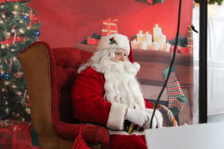 Santa greets families during the 2018 Hometown Holidays in downtown Camas Dec. 7, 2018.