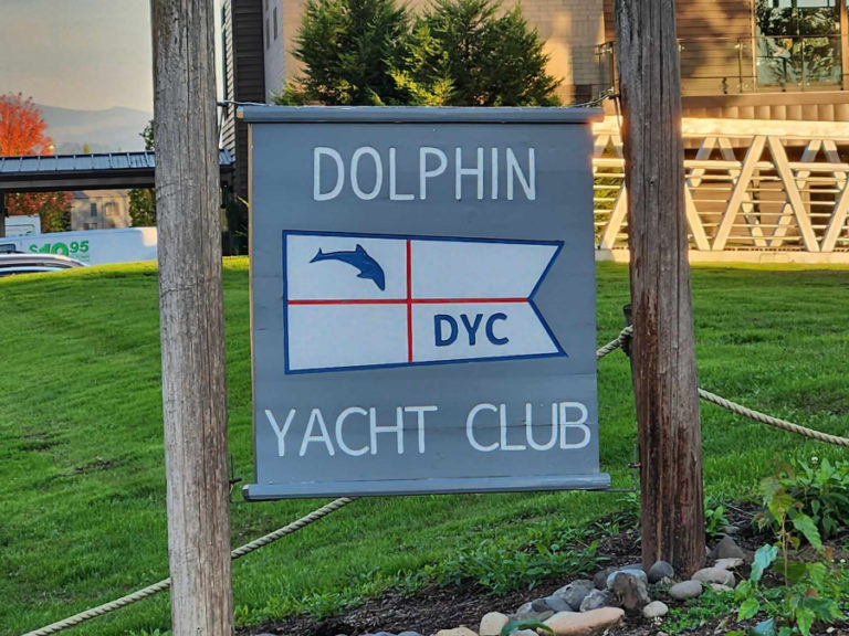 A sign for the Dolphin Yacht Club sits near the group's clubhouse at the Port of Camas-Washougal's marina on the Washougal waterfront.