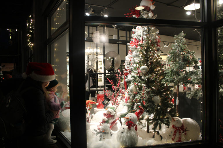 Visitors look at a holiday display inside Juxtaposition in downtown Camas during the 2022 Hometown Holidays event.