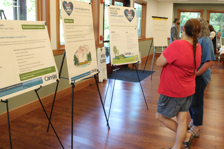 Kelly Moyer/Post-Record files 
 Visitors peruse signs and information at a city of Camas open house on the Lakes Management Plan at Lacamas Lake Lodge, July 17, 2023.