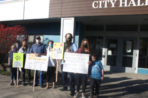 Washougal residents gather in front of Washougal City Hall Oct. 27, 2020, to protest higher-than-normal utility bills. (Doug Flanagan/Post-Record files)