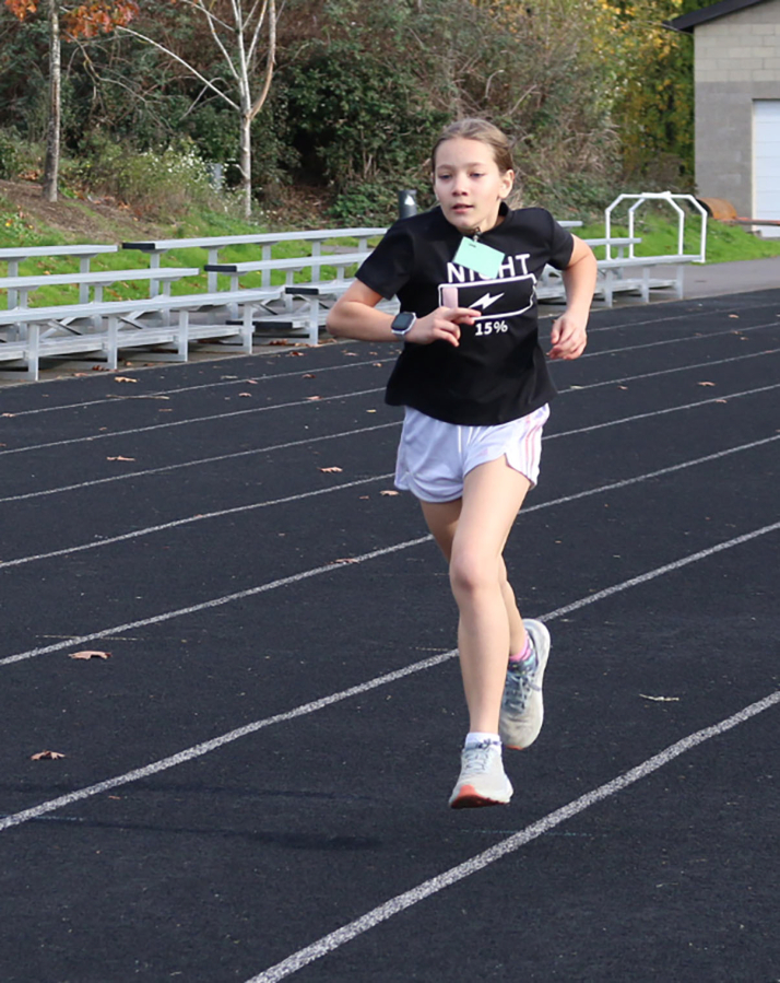 A Columbia River Gorge Elementary School fifth-grader runs during a Boosters Mileage Club session held in 2023, at the Jemtegaard Middle School track in Washougal.