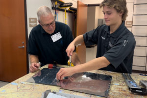 A volunteer works with a student at Cascadia Technical Academy in 2023. (Contributed photo courtesy of Cascadia Technical Academy Foundation)