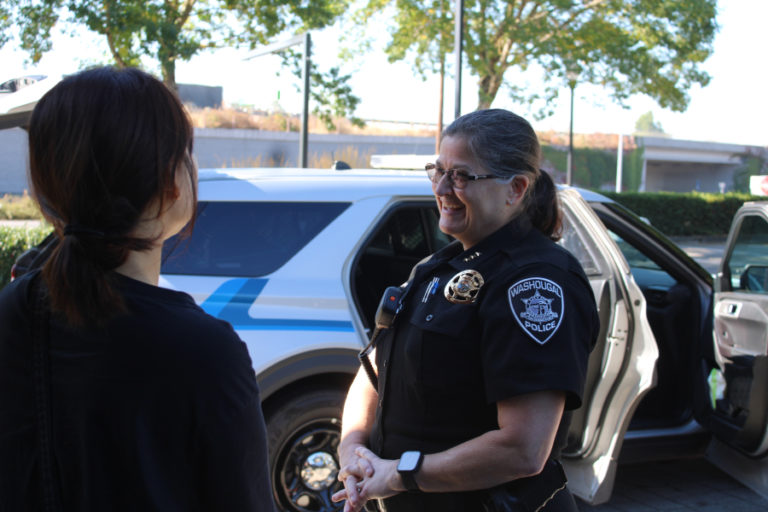 Washougal Police Chief Wendi Steinbronn (right) greets community members during a "Coffee with a Cop" event held Sept.