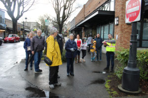 Clark County Historical Museum Executive Director Brad Richardson (right) leads a walking history tour of downtown Camas during the Downtown Camas Association’s “Spring into History” First Friday April 7, 2023 (Kelly Moyer/Post-Record files)