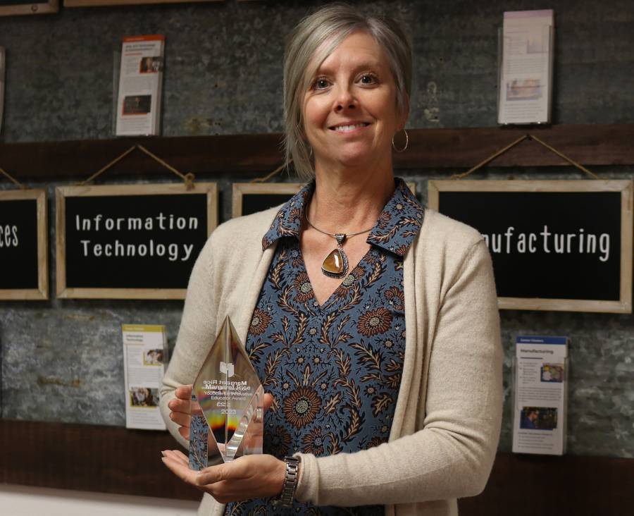 Margaret Rice, the Washougal School District's director of career and technical education, holds a plaque naming her the YouScience Innovative Educator for 2023.