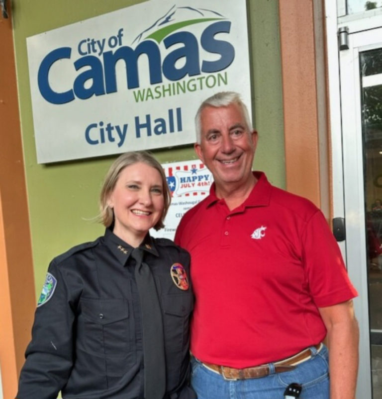Camas's new police chief, Tina Jones (left), stands outside Camas City Hall with retiring Camas Police Chief Mitch Lackey on Monday, July 3, 2023.