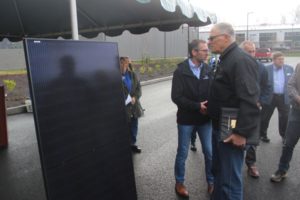 Washington Gov. Jay Inslee (center) inspects a solar panel used in Clark Public Utilities' Community Solar East project at the Port of Camas-Washougal's industrial park in Washougal, Friday, Jan. 5, 2024. (Photos by Doug Flanagan/Post-Record)