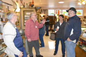 Dick Lindstrom (second from left), the new president of the Camas-Washougal Historical Society, visits with guests at Two Rivers Heritage Museum in 2016. (Contributed photo courtesy of Rene Carroll)