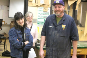 U.S. Rep. Marie Gluesenkamp Perez (WA-03) (left), visits with Washougal High School shop teacher Brent Mansell (right) in front of Washougal School District's director of career and technical education, Margaret Rice (center), at Washougal High, Wednesday, Jan. 24, 2024. (Doug Flanagan/Post-Record)