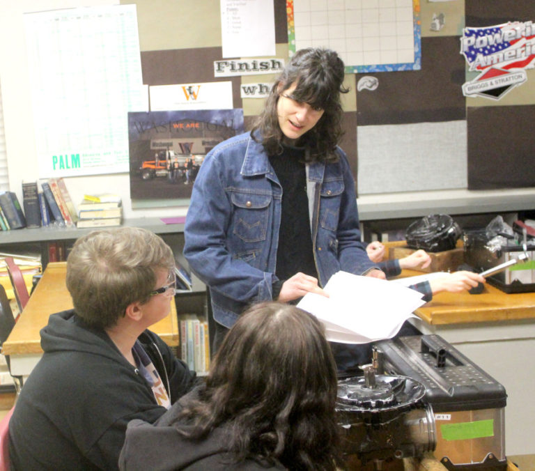 Democratic U.S. Rep. Marie Gluesenkamp Perez talks with Washougal High School students Samantha Zoeller and Wyatt Weaver at Washougal High School, Wednesday, Jan.