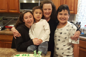 Washougal homicide victim Sandra Ladd (second from right) is pictured with three of her six grandchildren in an undated photo. (Photo courtesy of Mikaela Sasse)