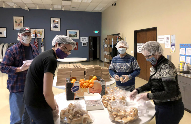 ReFuel Washougal volunteers prepare meals for their Friday night guests at the Washougal Community Center in an undated photo.