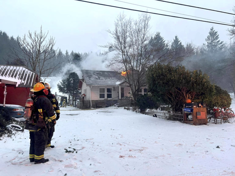 East County Fire and Rescue (ECFR) firefighters battle a two-alarm house fire in east Clark County in January 2024.