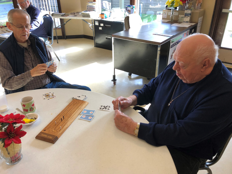 Don Edney (left) and Wally Budsberg (right) play cribbage at the Washougal Community Center, Jan. 7, 2019. (Kelly Moyer/Post-Record files)