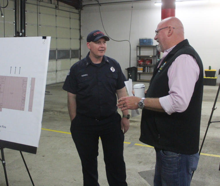 Washougal Mayor David Stuebe (right) talks with Camas-Washougal Fire Department captain Chris Ruddell about the city of Washougal&rsquo;s new fire station project during an open house on Thursday, Feb. 22, 2024, at Camas-Washougal Fire Department Station 43, in Washougal.