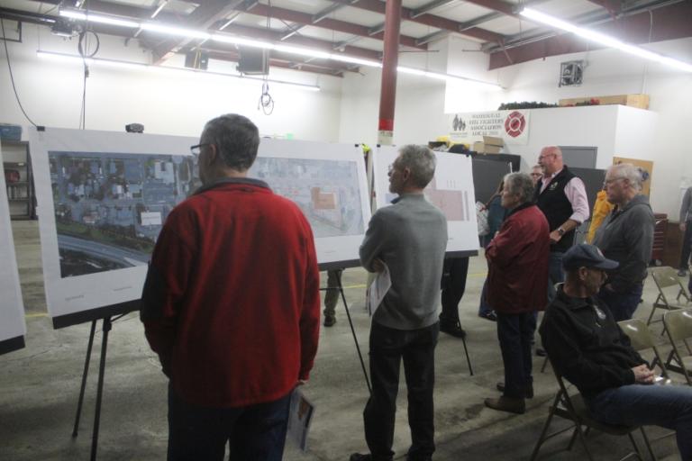 Attendees look at design options for the city of Washougal&rsquo;s new fire station project during an open house on Thursday, Feb. 22, 2024, at Camas-Washougal Fire Department Station 43, in Washougal.