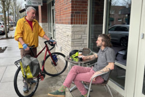 Washougal City Council member David Fritz (left) talks to Washougal Coffee Company employee Kevin Credelle in an undated photo. Fritz would like to see more bicycle friendly infrastructure built in Washougal to help bicyclists have safe options for riding to local businesses, parks, the Port of Camas-Washougal and the nearby city of Camas. (Contributed photo courtesy David Fritz)