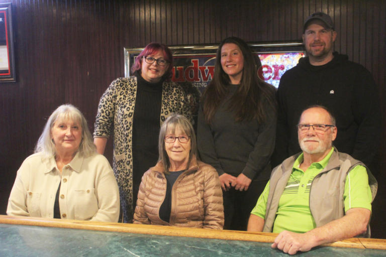 Members of the Heller family gather inside Washougal Times at the future &ldquo;Eldon&rsquo;s Bar,&rdquo; Thursday Feb. 22, 2024. Front row, left to right: Tina Nelson, Reta Heller and Randy Heller. Back row, left to right: Lacey Swanson, Amanda Stamets and Brad Heller.